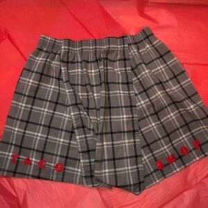 Upcycled boxers that read “TACO SHOP”
